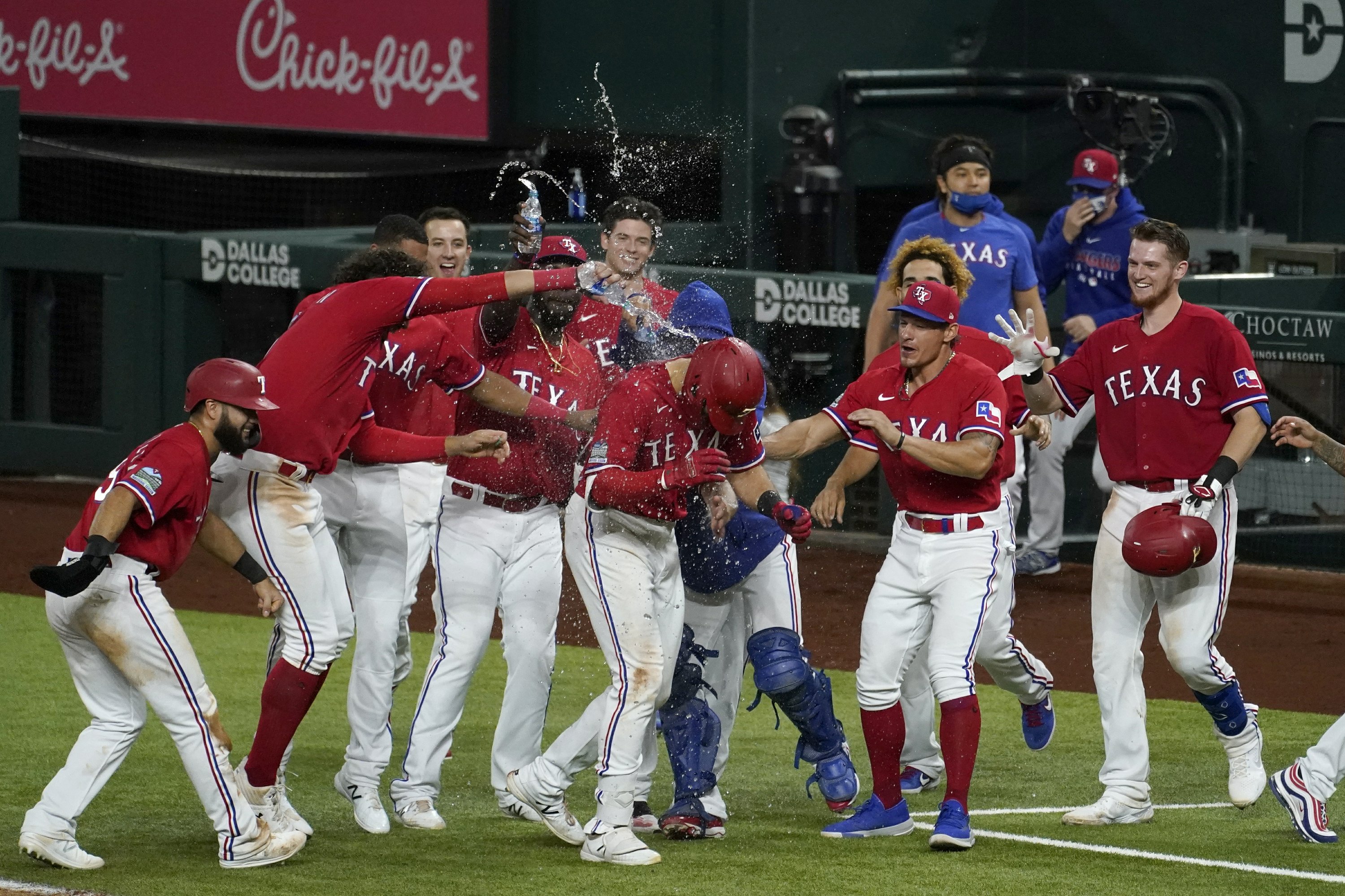 Astros clinch final AL playoff spot despite loss to Rangers AP News