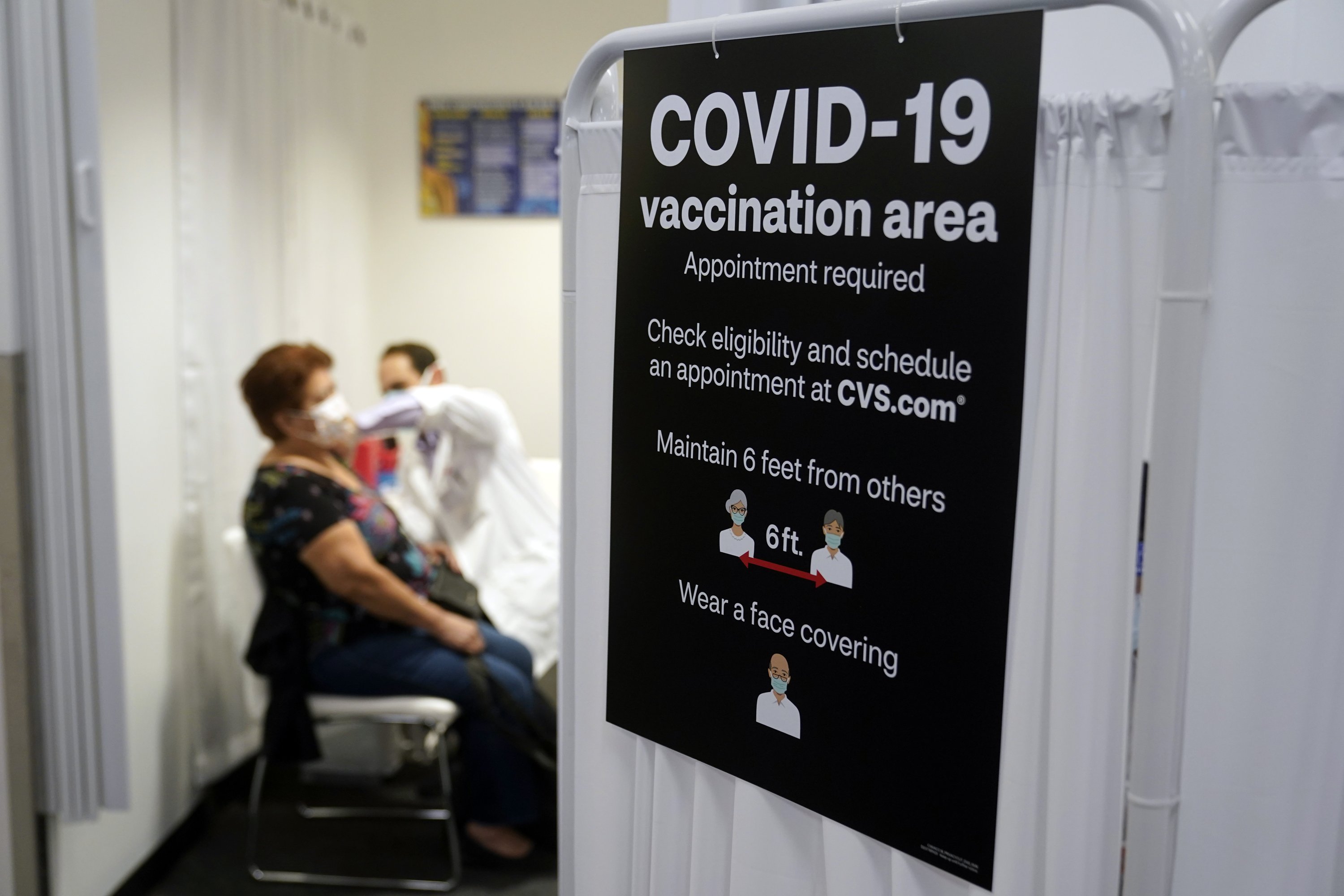 Americans vaccinated against COVID-19 are still awaiting advice