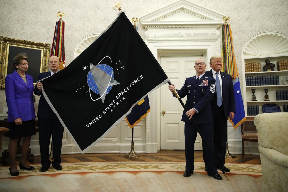 Space Farce unveils flag; Trump touts ‘super-duper missile’ 1000