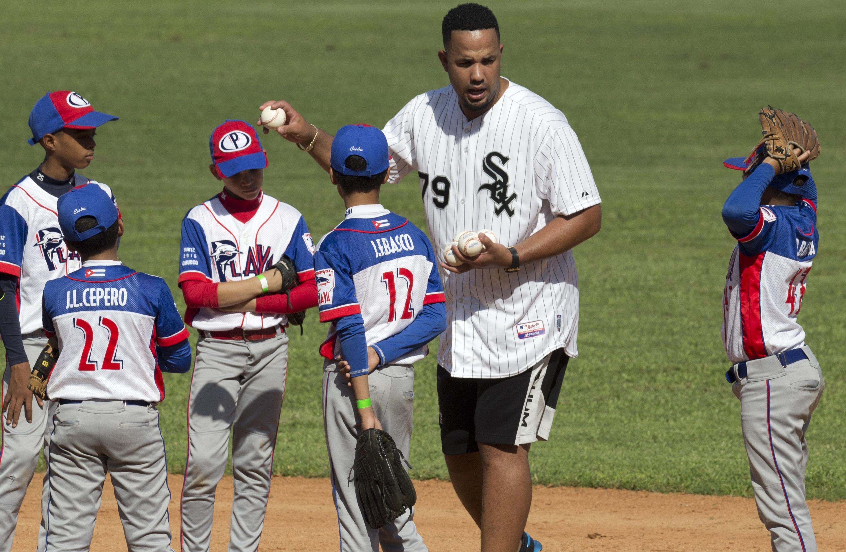 Cuban baseball defectors teach youth amid warming with US AP News