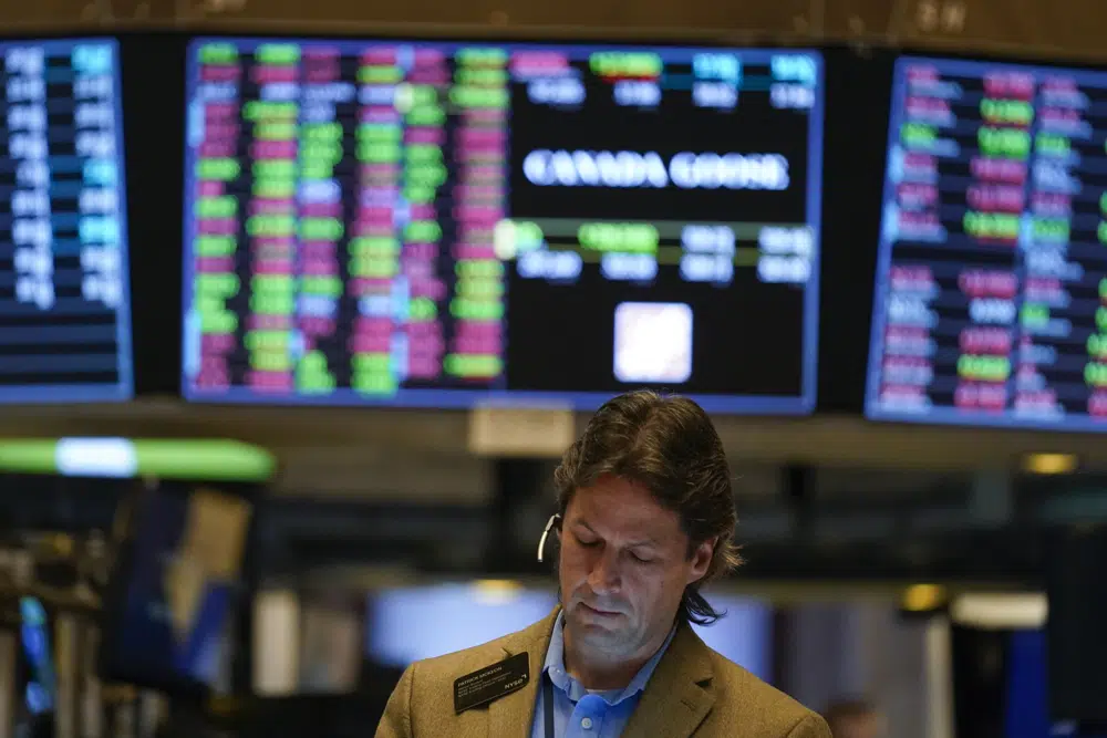 FILE - Traders work on the floor at the New York Stock Exchange in New York, Monday, Nov. 28, 2022. The worst may still be to come for the stock market. Wall Street has been on a mini-rebound since mid-October, recovering some of its sharp losses from the first 10 months of the year. Many analysts expect stocks to end 2023 around their current range, if not a bit higher, after the Federal Reserve finally stops hiking interest rates in order to get high inflation under control. (AP Photo/Seth Wenig)