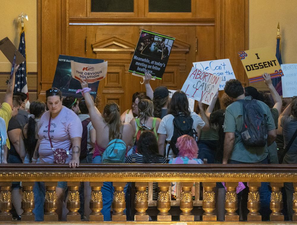 …Thousands of pro abortion people surrounded the Indiana Statehouse and filled its corridors Monday as Republican proposal to ban nearly all abortions was discussed