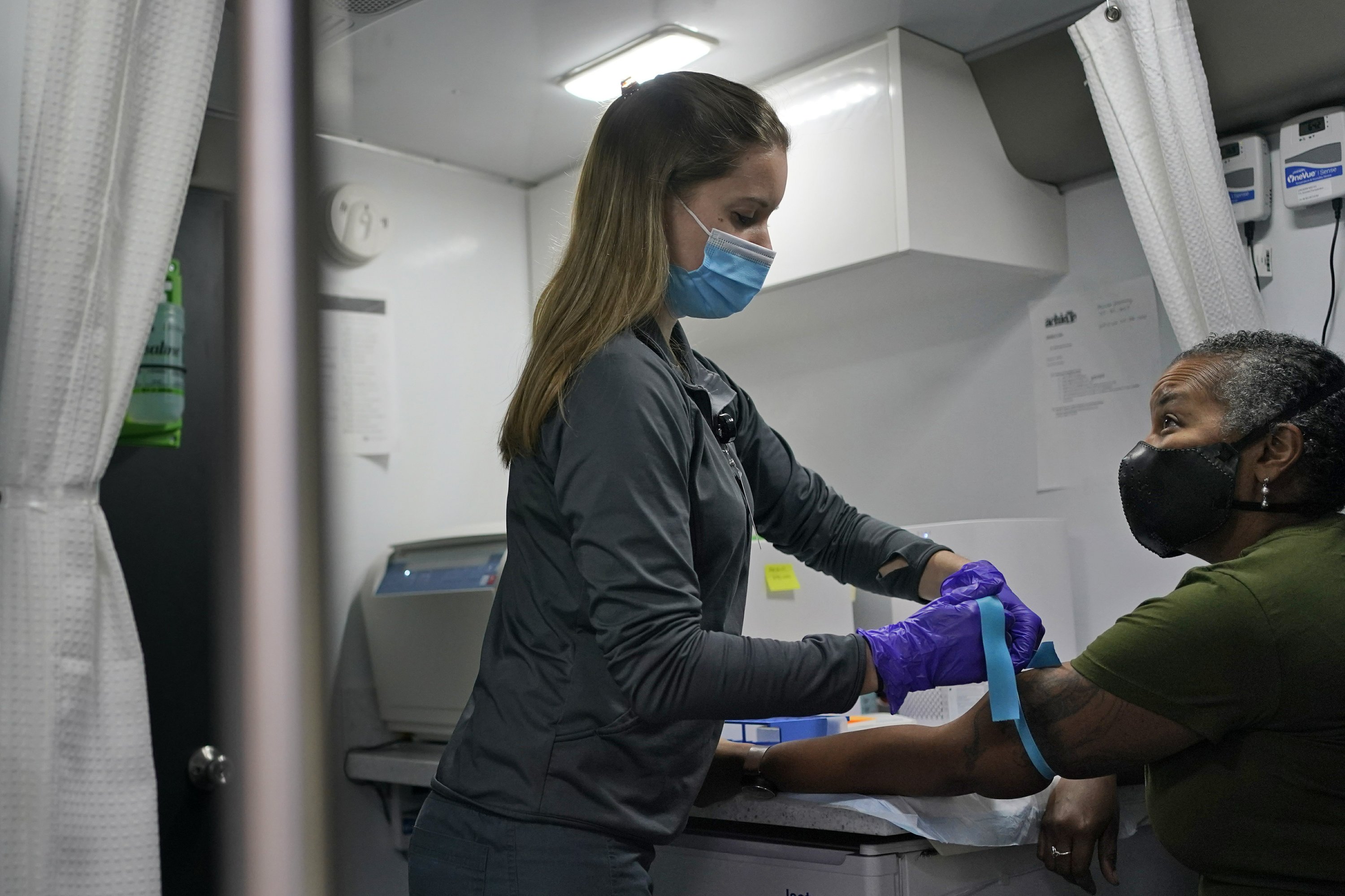 Mobile labs conduct vaccine studies in different neighborhoods