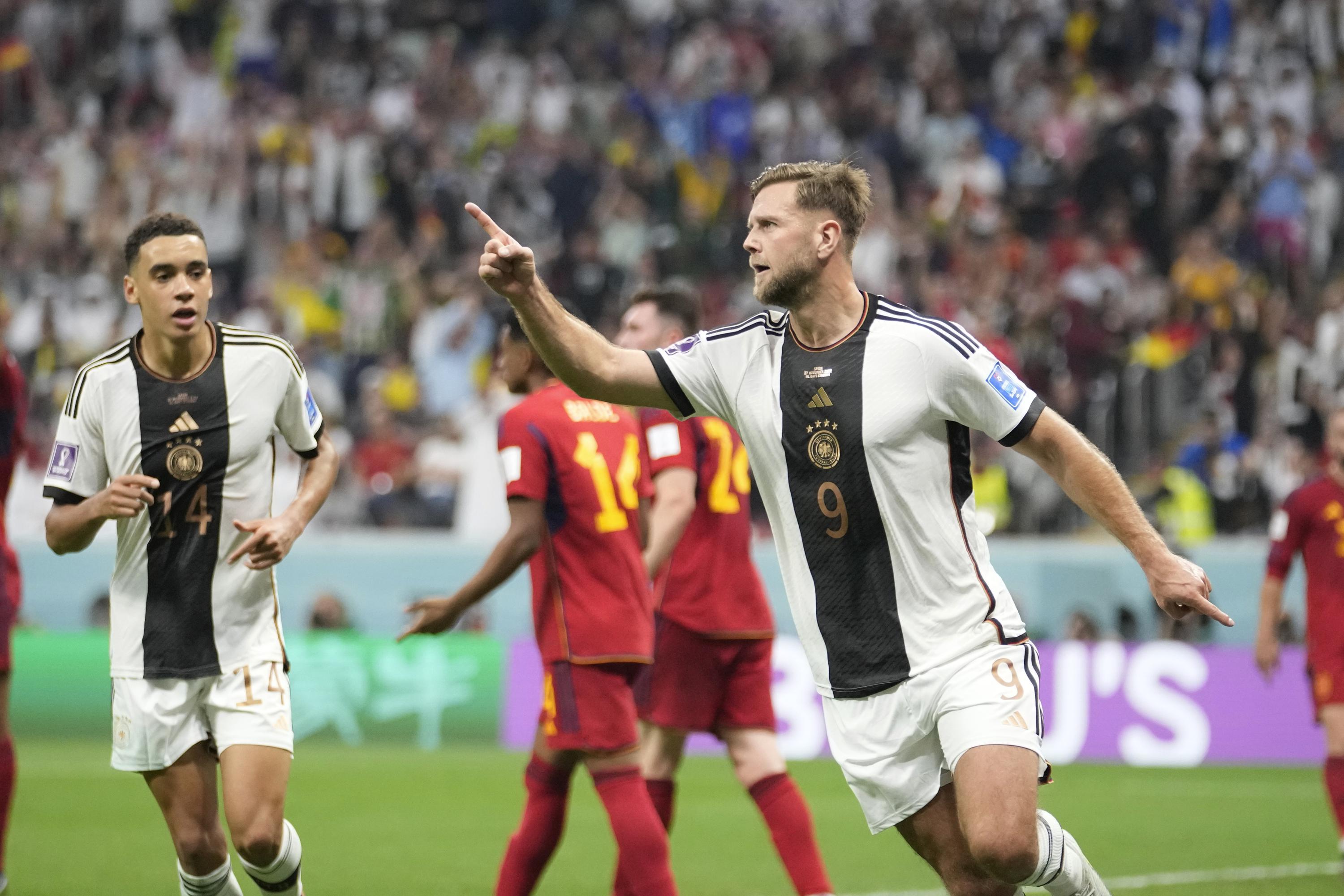 Germany salvages 11 draw against Spain at World Cup AP News