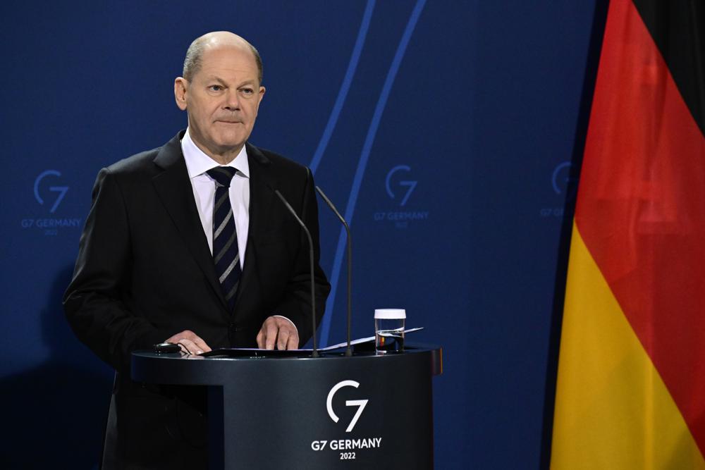 German Chancellor Olaf Scholz speaks during a media conference with French President Emmanuel Macronhead of their meeting at the chancellery in Berlin, Germany, Tuesday, Jan. 25, 2022. German and French leaders are meeting in Berlin over the Ukraine crisis and other European issues. (Tobias Schwarz/Pool Photo via AP, File)