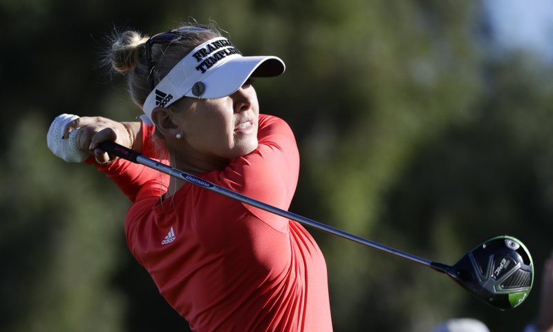 jessica korda watches her tee shot on the second