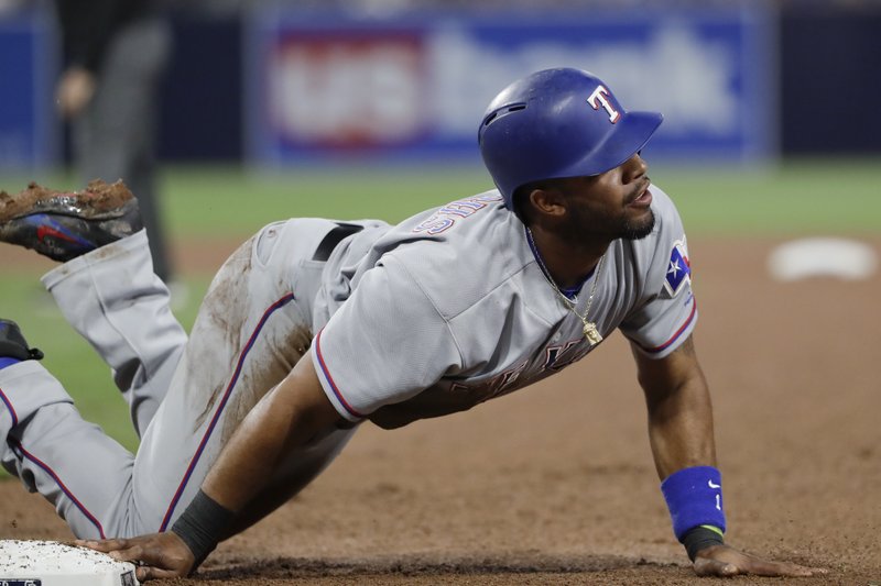 Texas Rangers' Elvis Andrus reacts after being called out, caught off the base by San Diego Padres starting pitcher Trevor Cahill during the fourth inning of a baseball game Monday, May 8, 2017, in San Diego. The play was overturned upon review. (AP Photo/Gregory Bull)