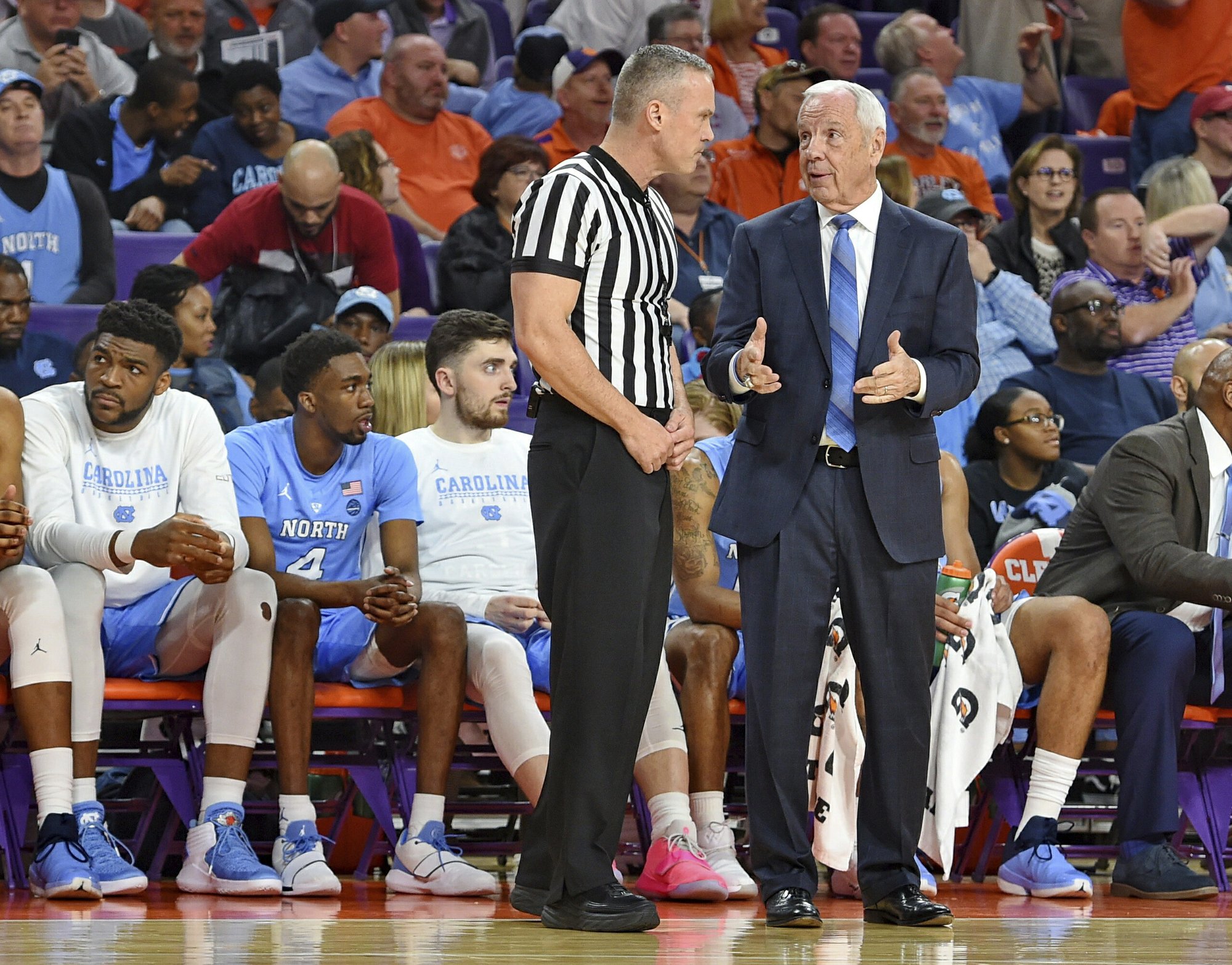 UNC's Roy Williams falls near bench 