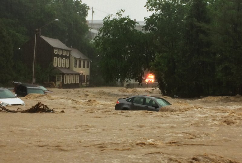 The Latest Witness Flash Flood Sweeps Cars Down Street