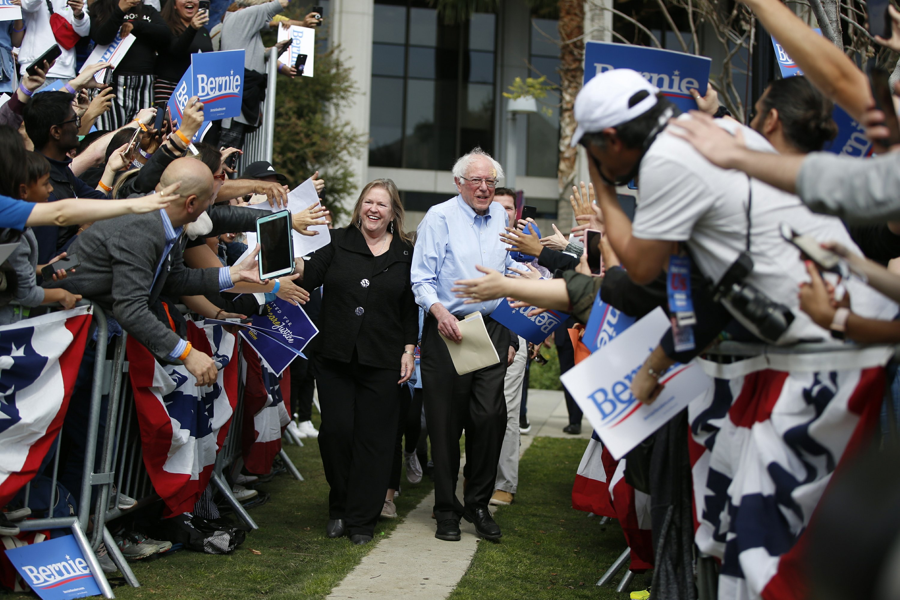 sanders supporters joining hands