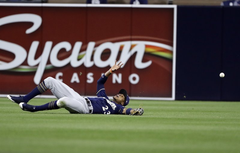The ball bounces away from Milwaukee Brewers center fielder Keon Broxton on an RBI double by San Diego Padres’ Yangervis Solarte during the sixth inning of a baseball game Wednesday, May 17, 2017, in San Diego. (AP Photo/Gregory Bull)