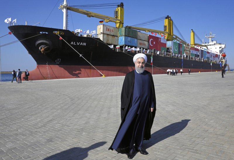 Iranian President Hassan Rouhani poses during the inauguration a newly built extension of the port of Chabahar, near the Pakistani border, on the Gulf of Oman, southeastern Iran, Sunday, Dec. 3, 2017. The $340 million project was constructed by a Revolutionary Guard-affiliated company, Khatam al-Anbia, the largest Iranian contractor of government construction projects. It brings the port's capacity to 8.5 million tons of cargo, from the previous 2.5 million tons and challenges the Gwadar port across the border in Pakistan. (AP Photo/Ebrahim Noroozi)