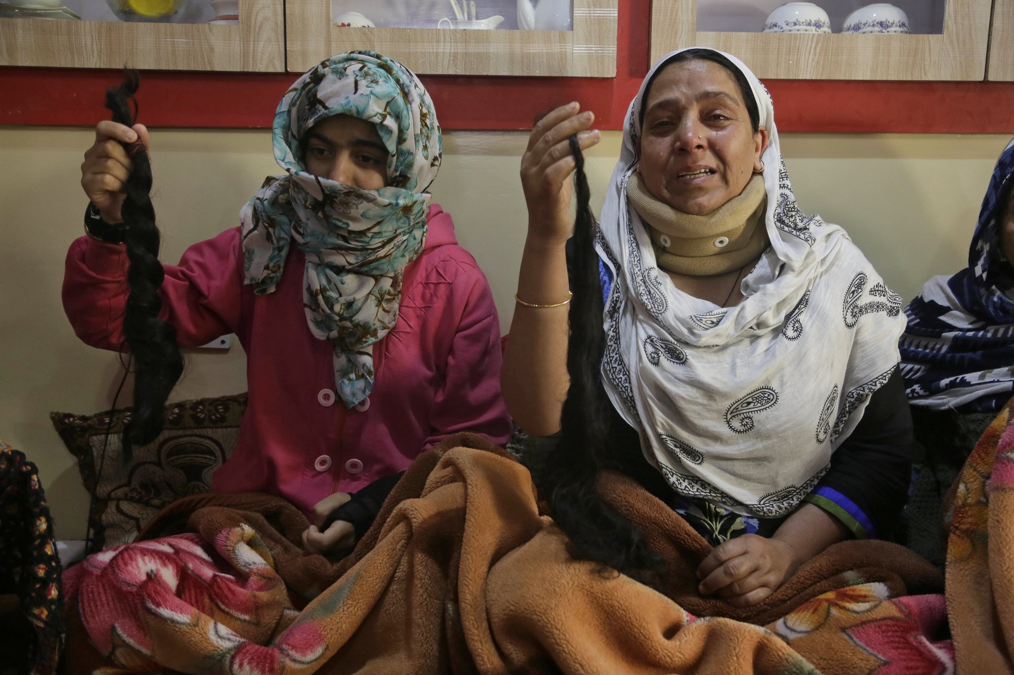 Mystery attacks chopping women's hair raise panic in Kashmir | AP News