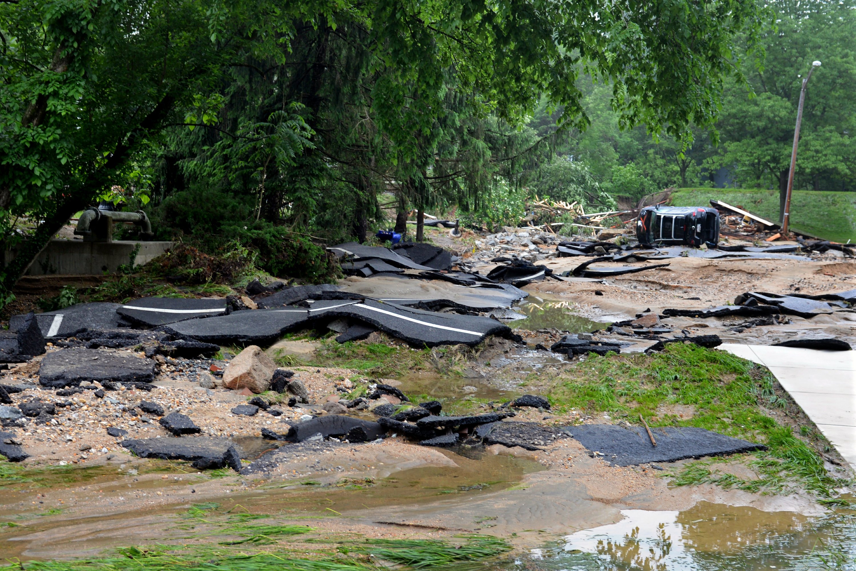 After pair of 1in1000 year floods, a town seeks safeguards AP News