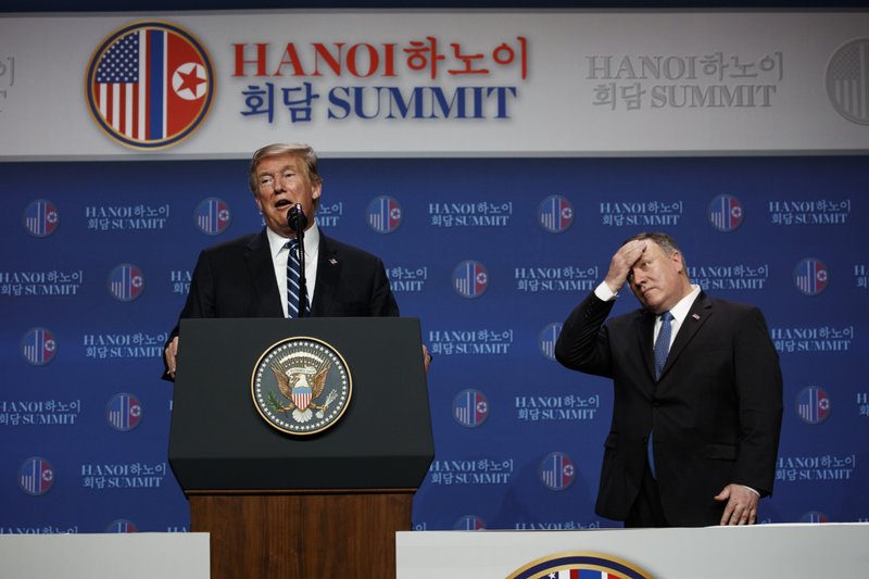 President Donald Trump speaks as Sec of State Mike Pompeo looks on during a news conference after a summit with North Korean leader Kim Jong Un, Thursday, Feb. 28, 2019, in Hanoi. (AP Photo/ Evan Vucci)