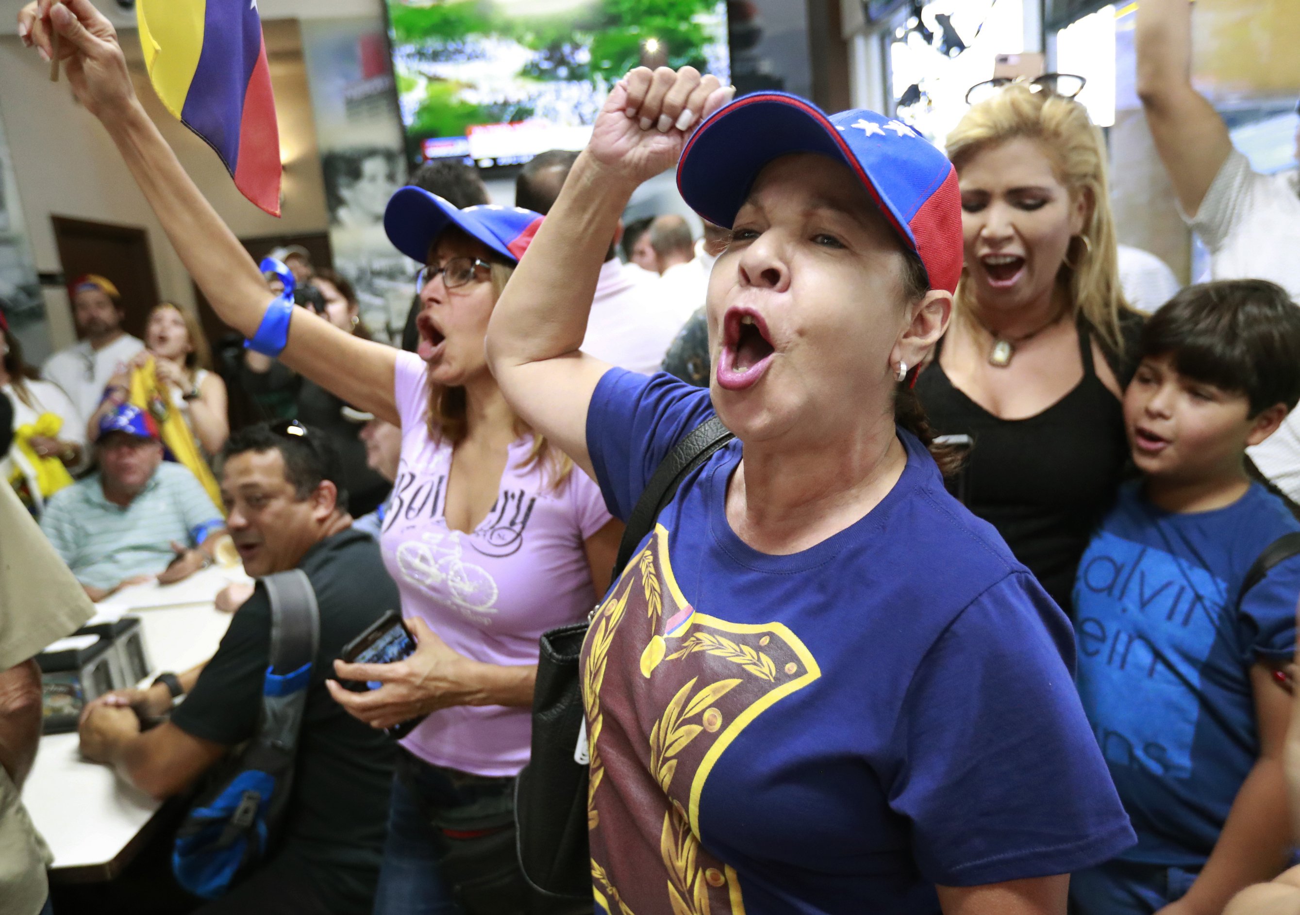 The Latest: Venezuelans in US watch turmoil with hope, worry