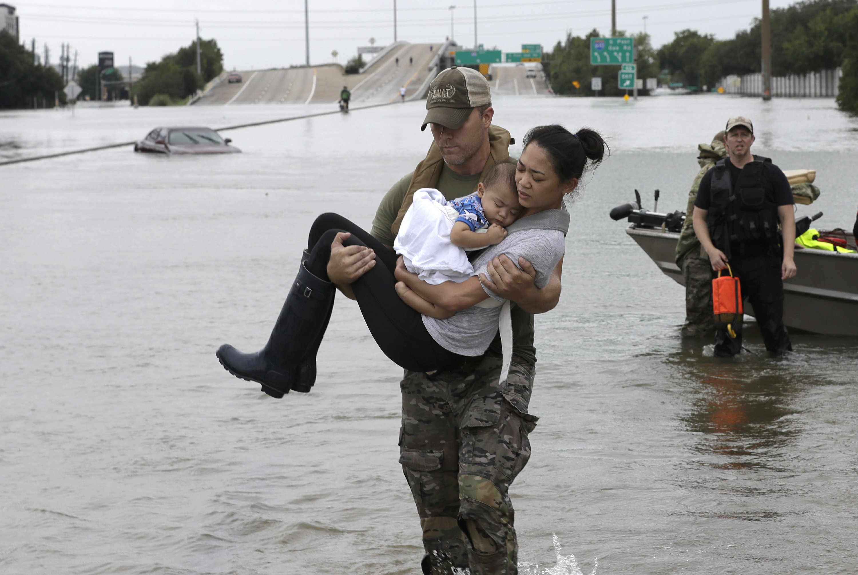 photo-of-mother-and-baby-s-rescue-becomes-symbol-of-storm