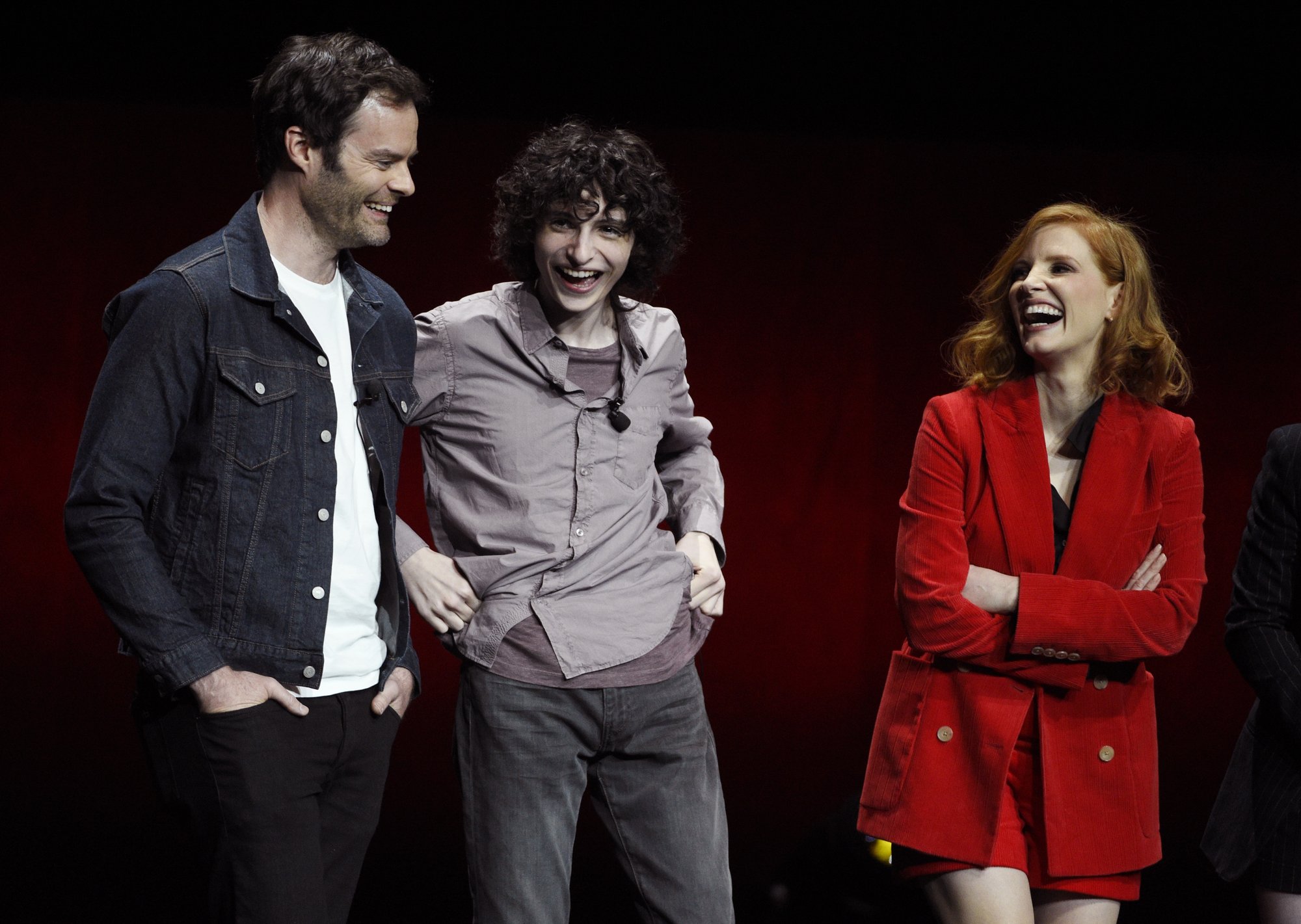 Image result for Bill Hader, left, Finn Wolfhard, center, and Jessica Chastain, cast members in the upcoming film âIt: Chapter Two,â share a laugh onstage during the Warner Bros. presentation at CinemaCon 2019, the official convention of the National Association of Theatre Owners (NATO) at Caesars Palace, Tuesday, April 2, 2019, in Las Vegas.