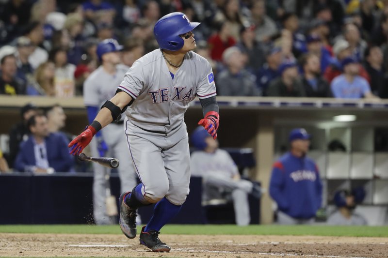 Texas Rangers' Shin-Soo Choo watches his home run hit during the seventh inning of a baseball game against the San Diego Padres Monday, May 8, 2017, in San Diego. (AP Photo/Gregory Bull)