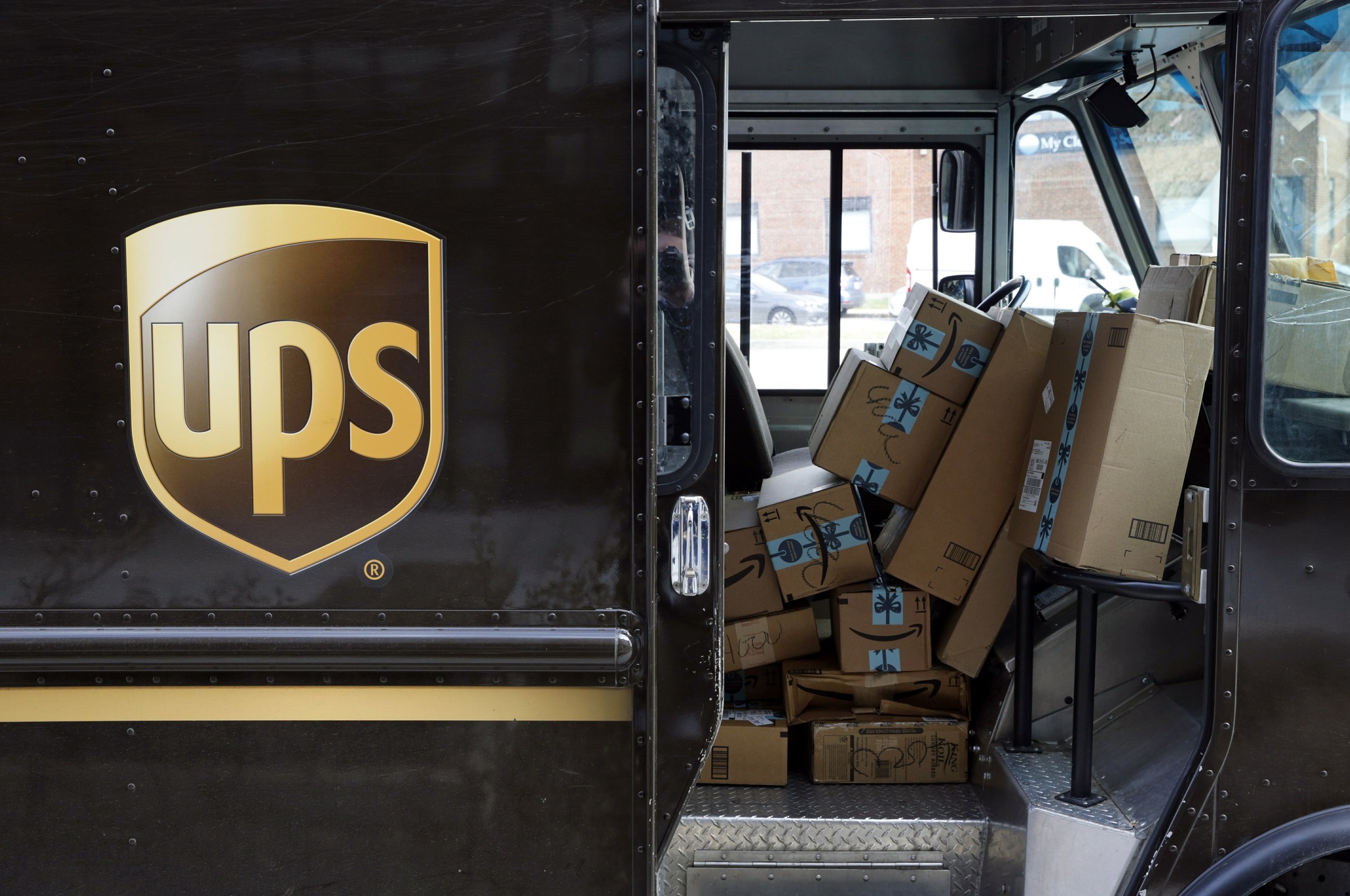 UPS' profit slips, but results top expectations, shares rise AP News