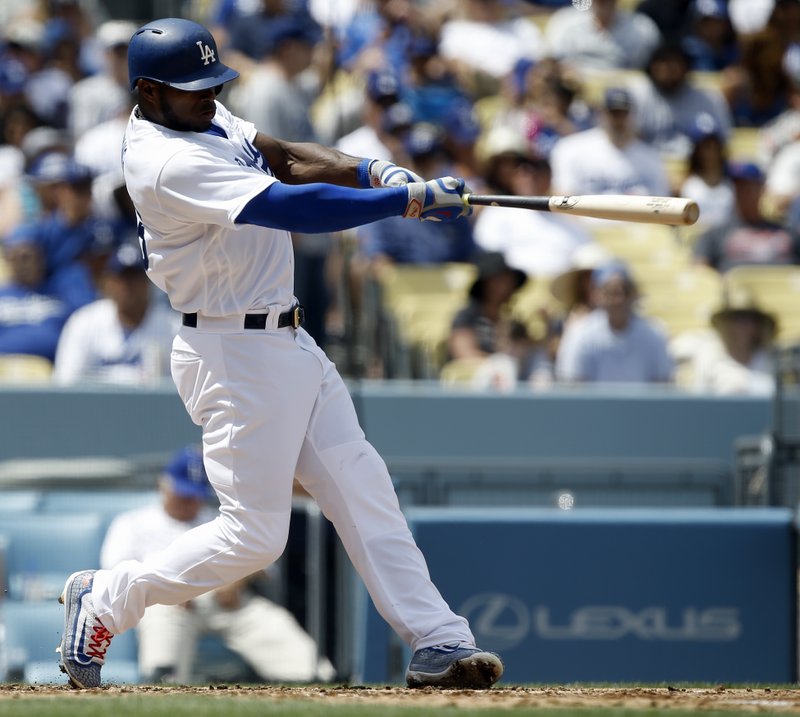 Los Angeles' Yasiel Puig hits his second two-run home run of the game, against the San Diego Padres during the fourth inning of a baseball game in Los Angeles, Thursday, April 6, 2017. (AP Photo/Alex Gallardo)