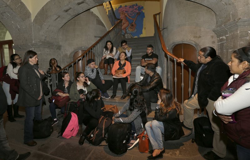 In this Dec. 22, 2016 photo, Mexican youth who migrated to the U.S. as children gather before starting a group therapy session, on their first day back to their native country, in Mexico City. In the weeks just before President-elect Donald Trump was sworn in, more than two dozen young immigrants made the journey back to Mexico under a provision of DACA that allows recipients to leave the U.S. for academic reasons or family emergencies and then legally return. (AP Photo/Marco Ugarte)