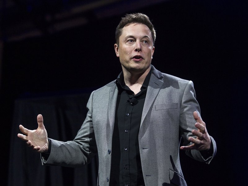 FILE - In this April 30, 2015, file photo, Tesla Motors CEO Elon Musk unveils the company's newest products, in Hawthorne, Calif. (AP Photo/Ringo H.W. Chiu, File)