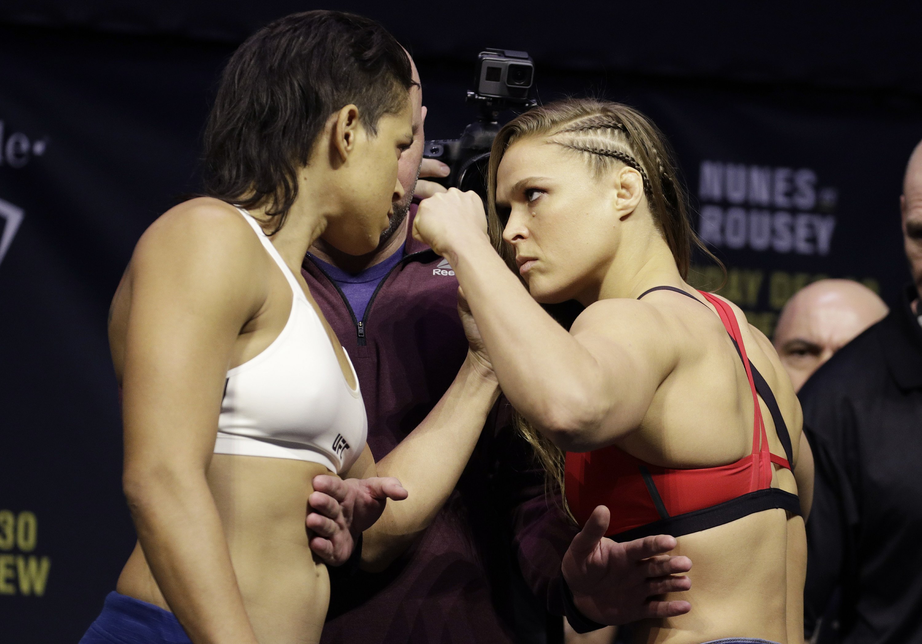 Ronda Rousey returns to reclaim her title belt at UFC 207 AP News