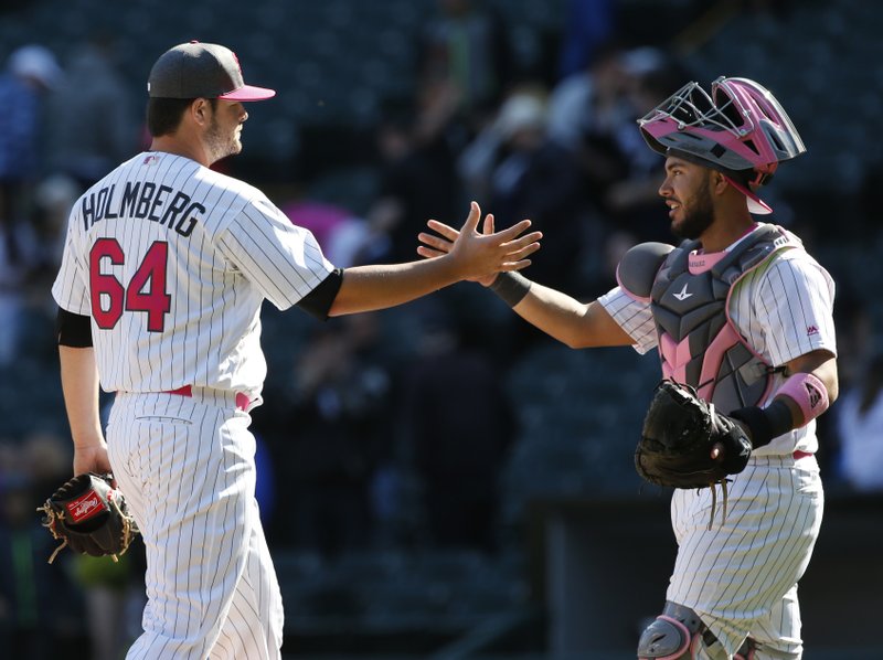 Chicago White Sox relief pitcher David Holmberg, left, celebrates with catcher Omar Narvaez after they defeated the San Diego Padres in an interleague baseball game in Chicago, Sunday, May 14, 2017. (AP Photo/Nam Y. Huh)