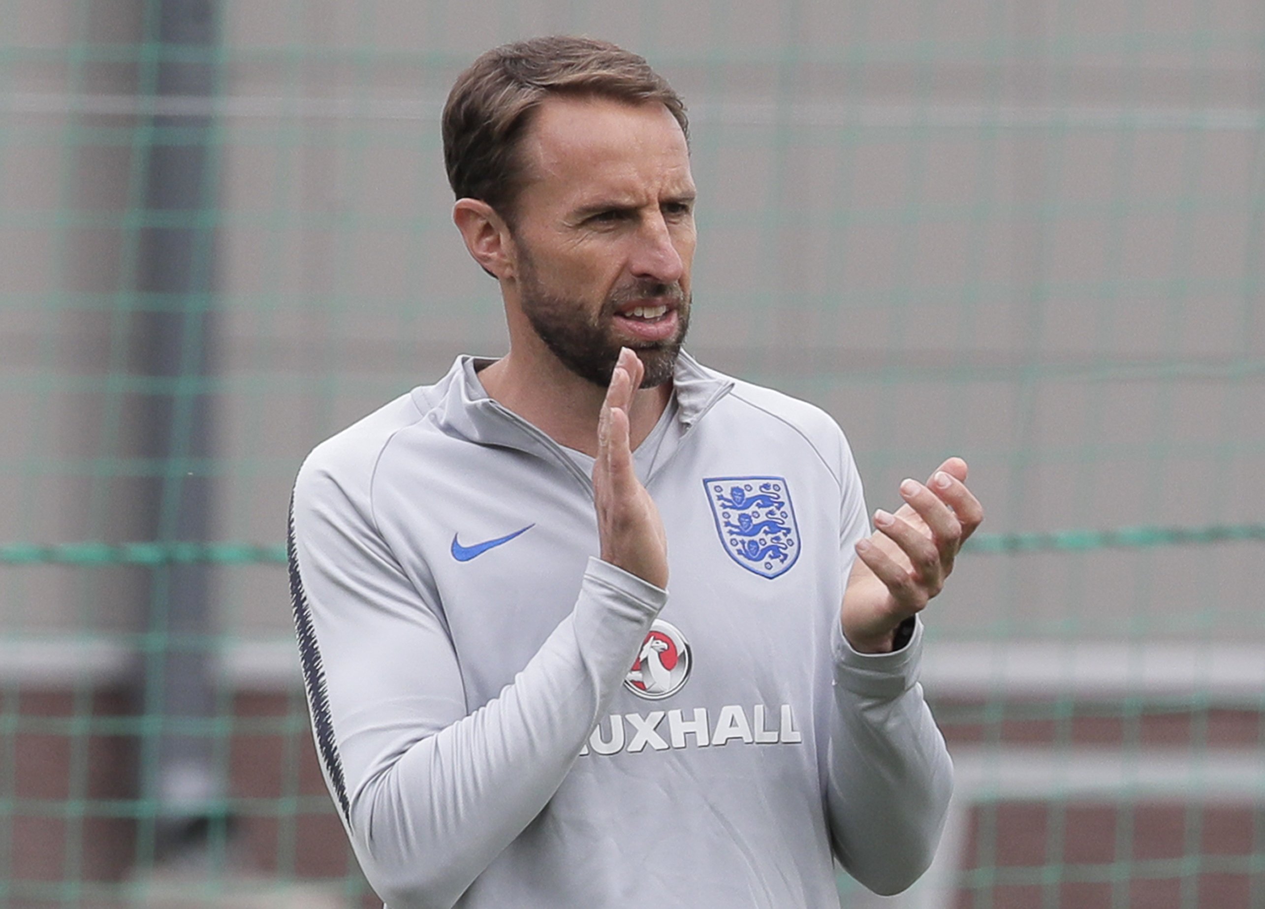 England coach dislocates shoulder while running AP News