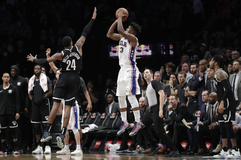 3-pointer caps 76ers' rally to beat Nets