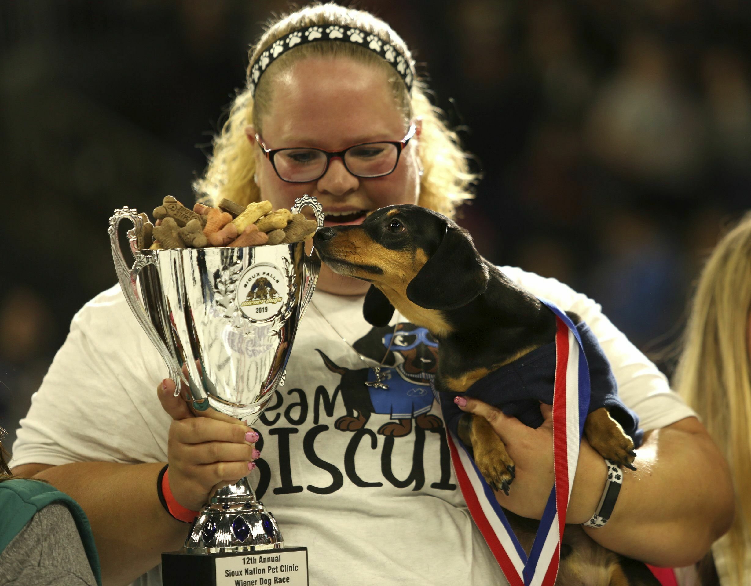 Wiener dog race steals the show at South Dakota hockey game AP News