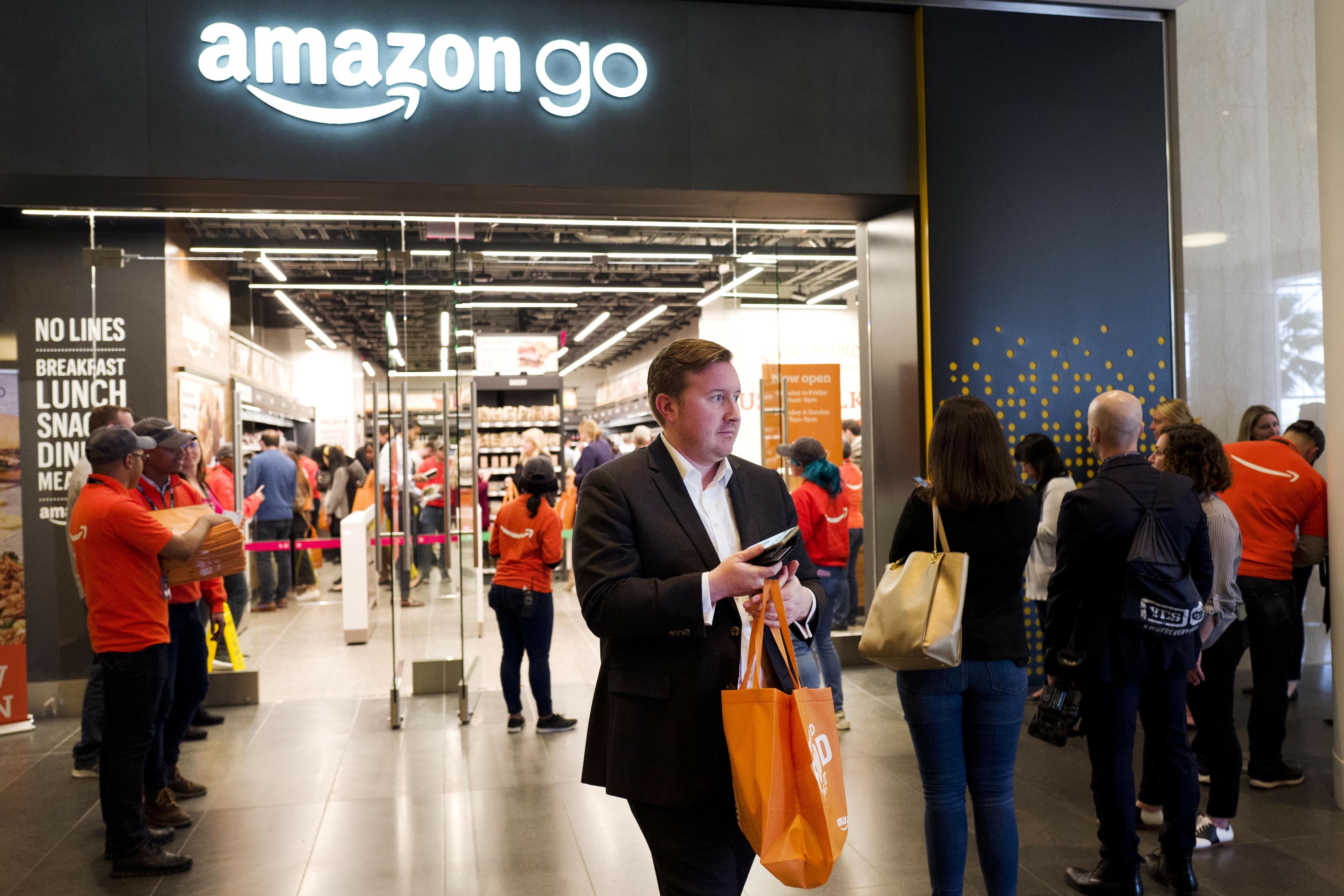 Amazon opens first Go store that accepts cash | AP News