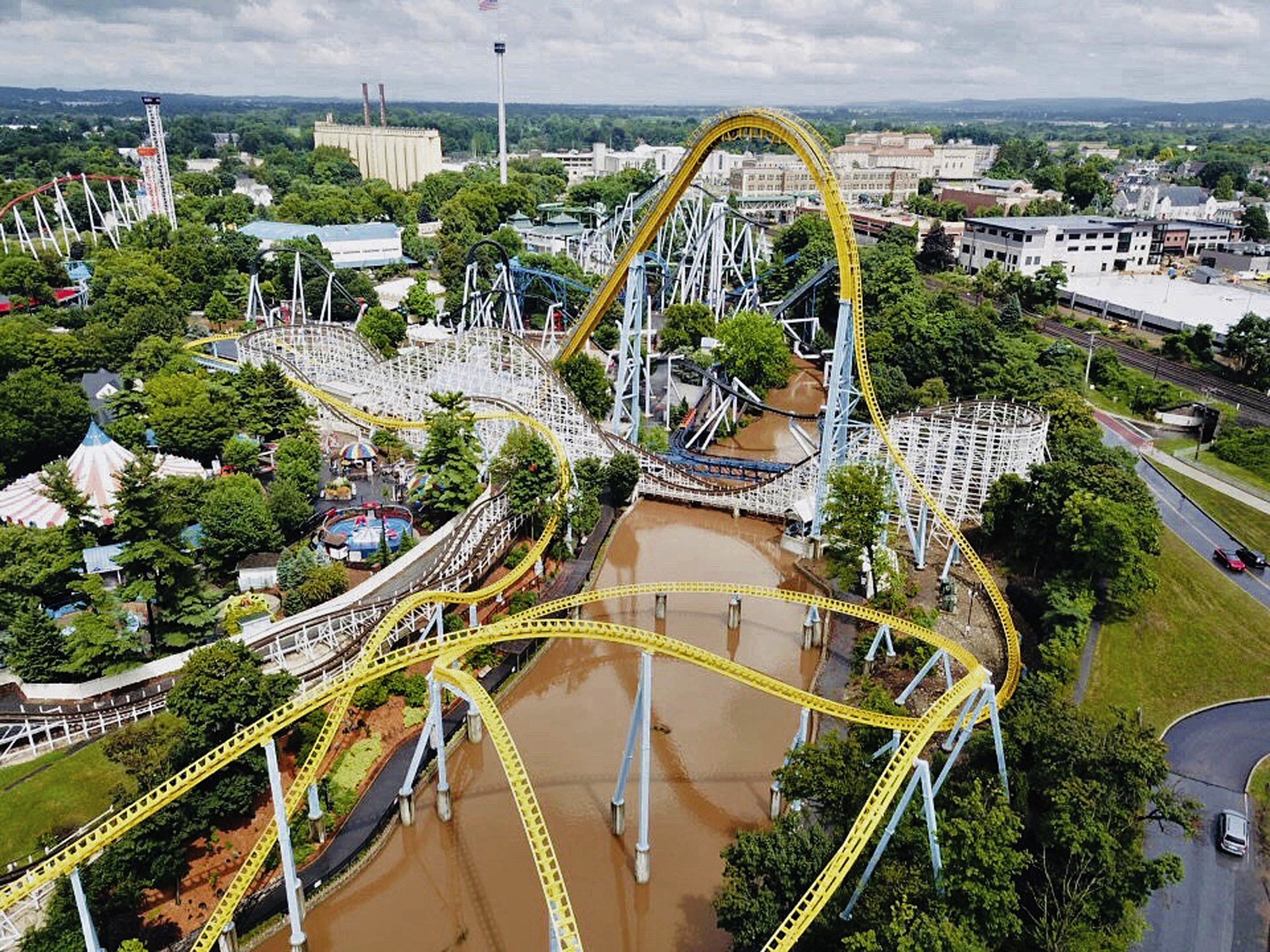 (AP) — Heavy rain and flash flooding made it appear a river of chocolate wa...