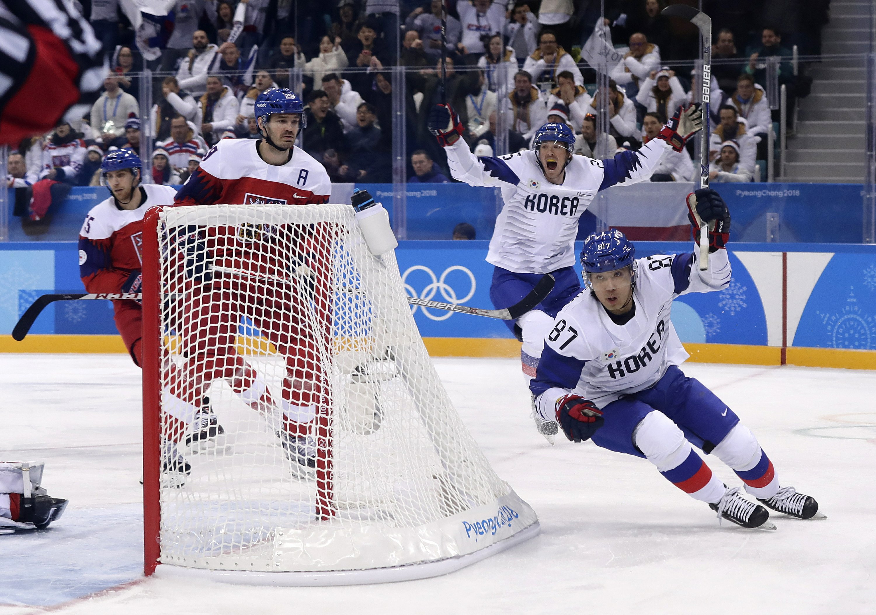 Lively scene as South Korea men play 1st Olympic hockey game | AP News