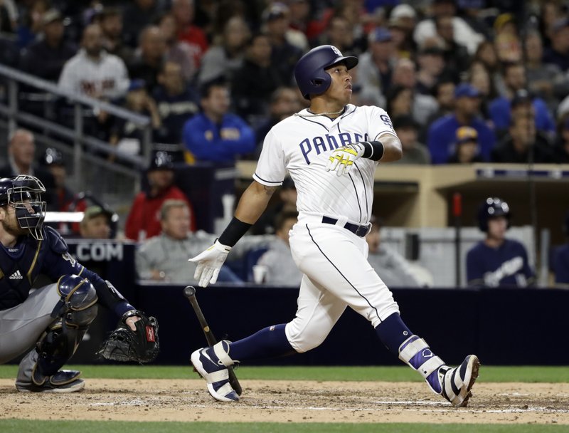 San Diego Padres' Yangervis Solarte watches his RBI double during the sixth inning of a baseball game against the Milwaukee Brewers on Wednesday, May 17, 2017, in San Diego. (AP Photo/Gregory Bull)