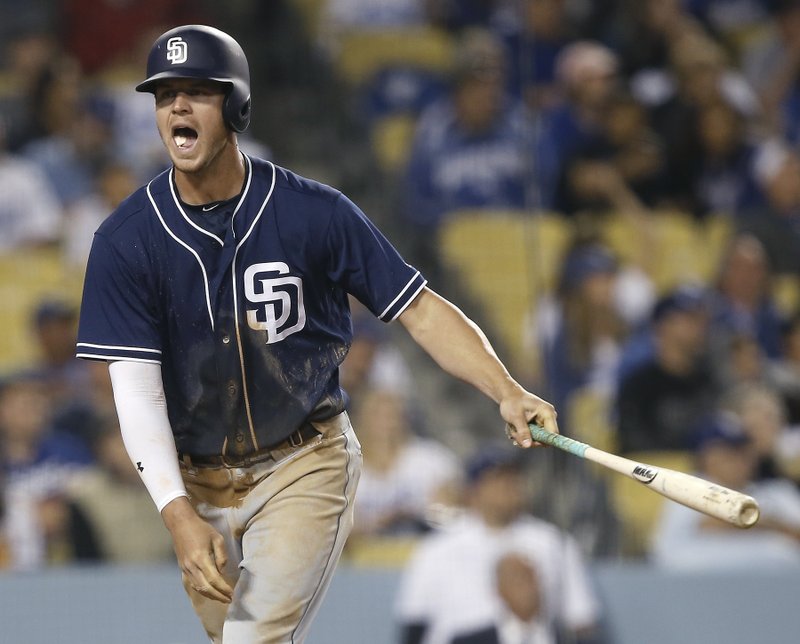 San Diego Padres' Wil Myers reacts after hitting a fly ball for an out to center against the Los Angeles Dodgers during the eighth inning of a baseball game in Los Angeles, Wednesday, April 5, 2017. (AP Photo/Alex Gallardo)