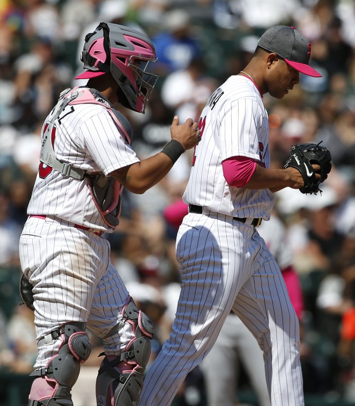 White Sox catcher Omar Narvaez, left, talks to starting pitcher Jose Quintana during the seventh inning of an interleague baseball game against the San Diego Padres in Chicago, Sunday, May 14, 2017. (AP Photo/Nam Y. Huh)