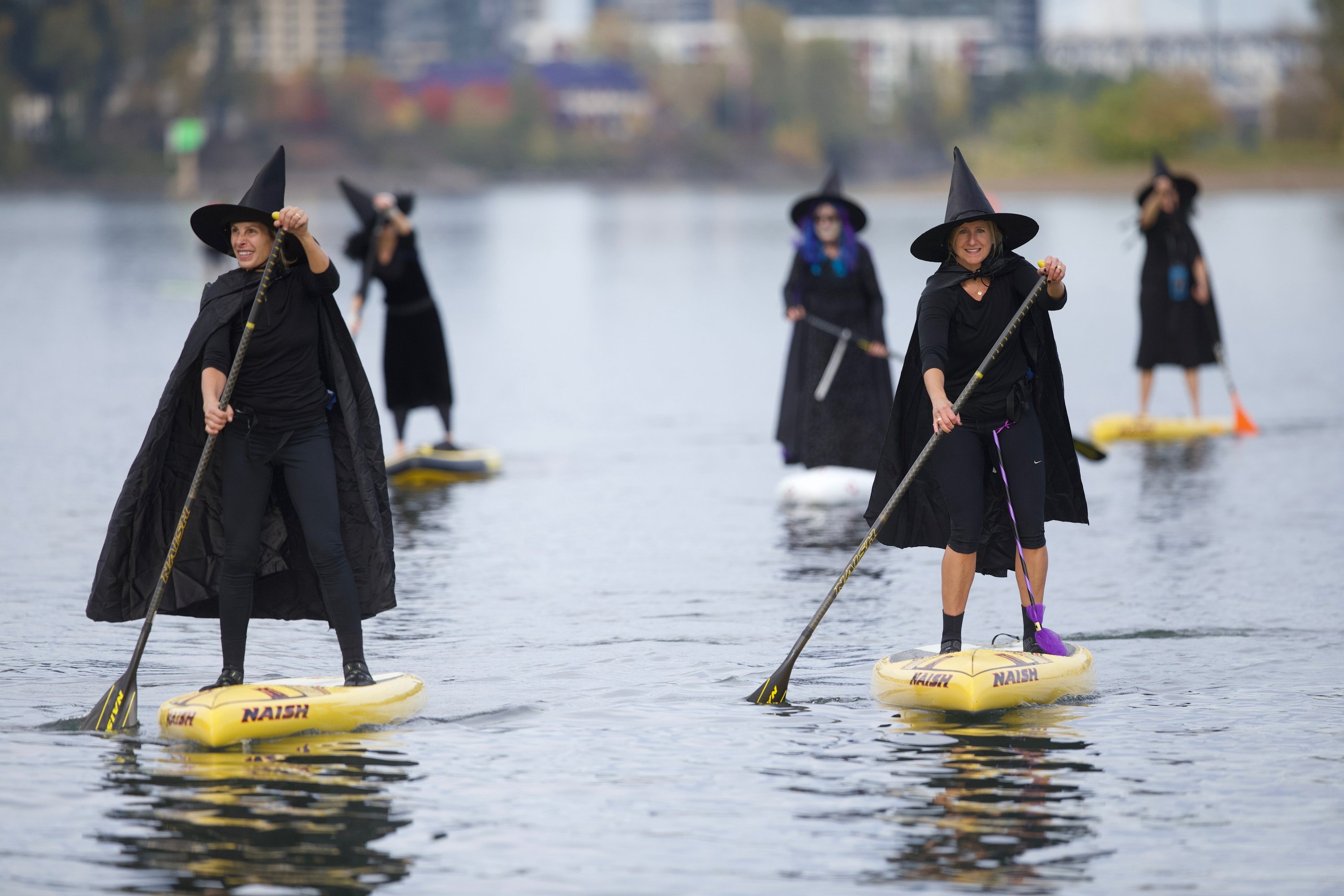 100s of Oregon 'witches' paddle down river, minus the brooms