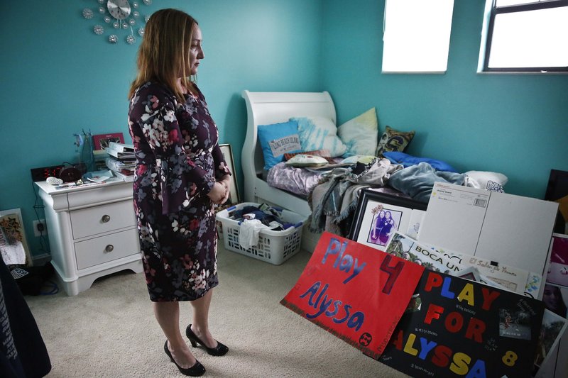 Lori Alhadeff stands in her daughter's bedroom on Wednesday, Jan. 30, 2019, in Parkland, Florida. (AP Photo/Brynn Anderson)