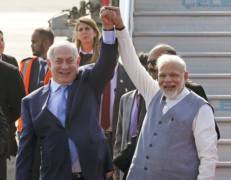 Israel's Prime Minister Benjamin Netanyahu, left, is welcomed by India's Prime Minister Narendra Modi on his arrival at Palam airport in New Delhi Sunday, Jan. 14, 2018. Israeli Prime Minister Netanyahu arrived Sunday for his first visit to India to expand defense, trade and energy ties. (AP Photo)