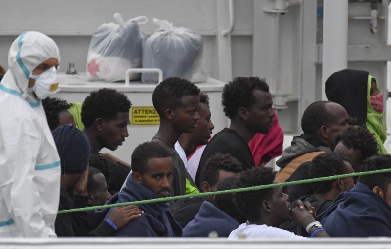 Image result for migrants on the harbor of italy
