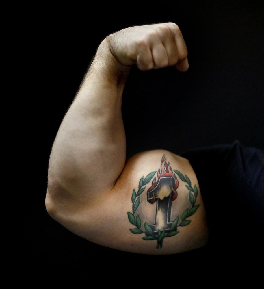 Arm wrestling looks to climb beyond barroom bragging rights | AP News