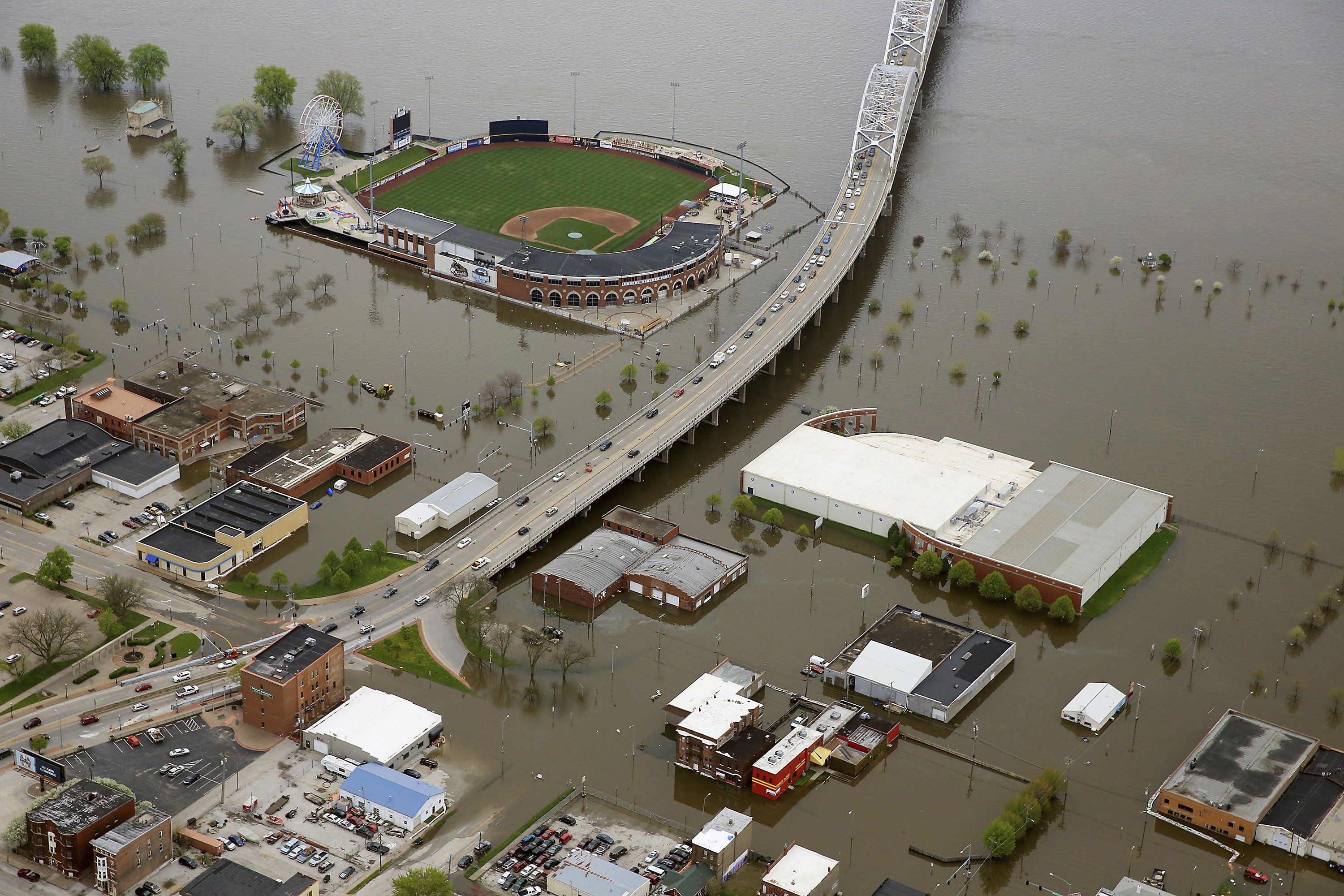 Crews rebuild flood barrier to protect downtown Davenport AP News