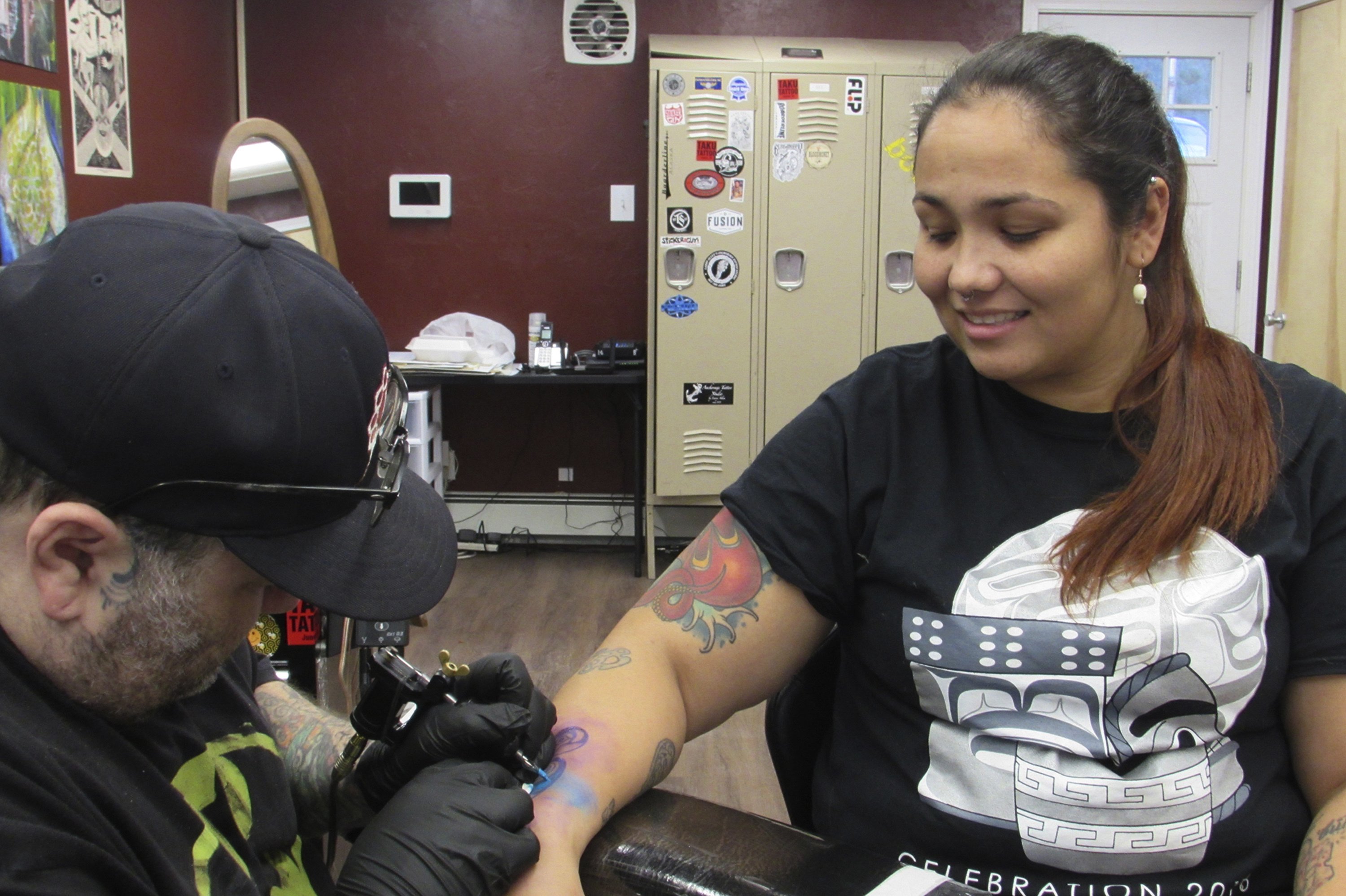 Survivors, moms get tattoos for suicide prevention | AP News