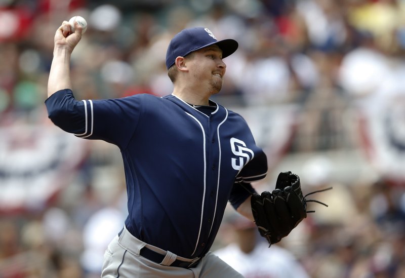 San Diego Padres' starting pitcher Trevor Cahill throws against the Atlanta Braves in the first inning of a baseball game Sunday, April 16, 2017, in Atlanta. (AP Photo/John Bazemore)