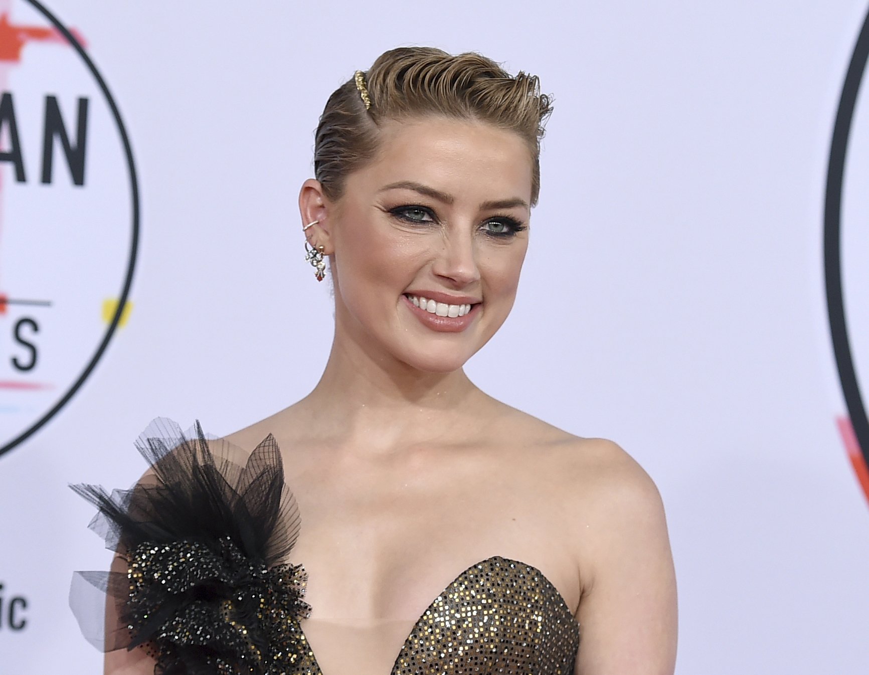 Amber Heard says she is happy to have moved on with her life | AP News Amber Heard says she is happy to have moved on with her life | AP News