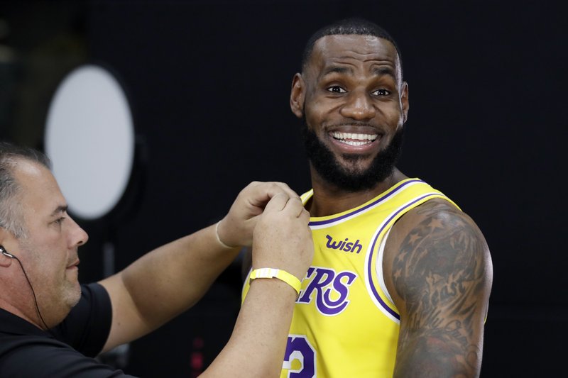 lebron holding lakers jersey