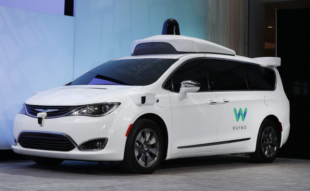 FILE - In this Jan. 8, 2017, file photo a Chrysler Pacifica hybrid outfitted with Waymo's suite of sensors and radar is displayed at the North American International Auto Show in Detroit. (AP Photo/Paul Sancya, File)