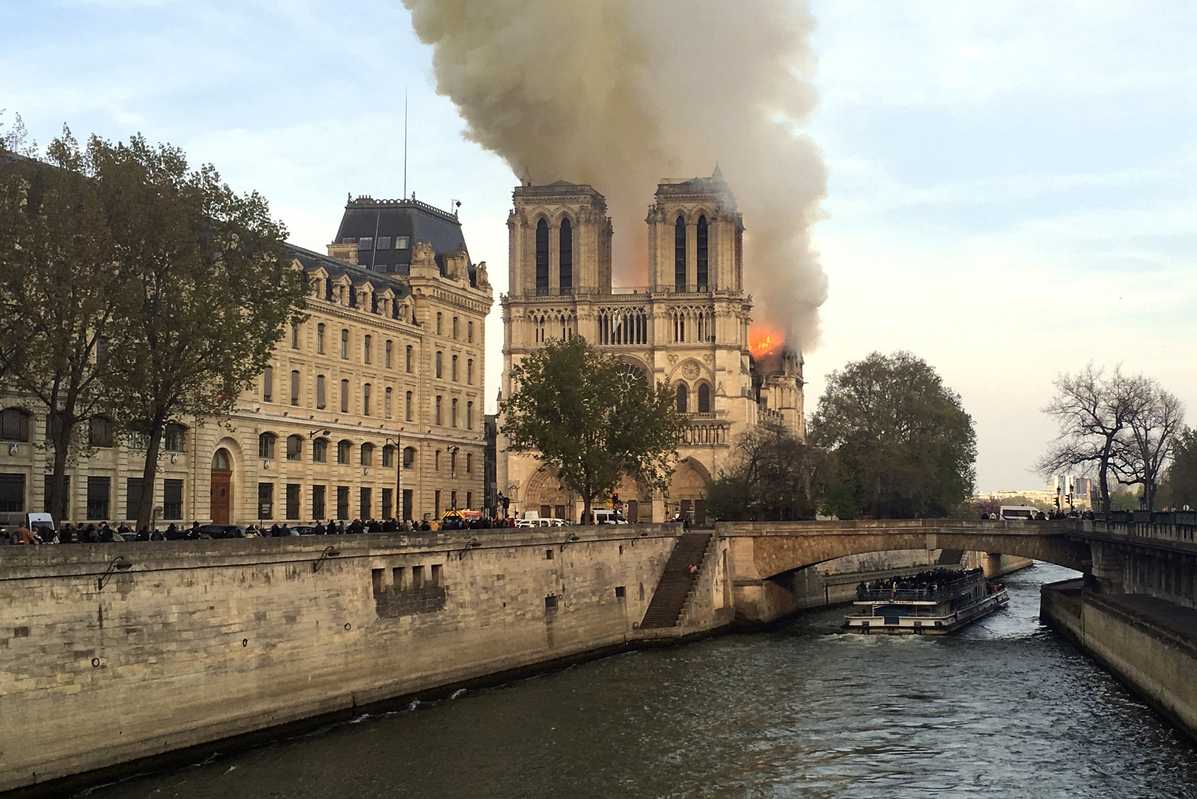 The Latest: Notre Dame spire collapses, interior in flames